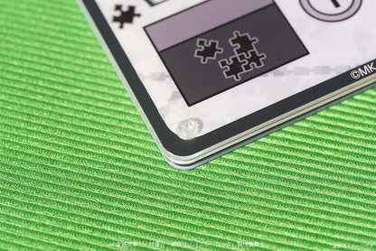 凪誠士郎夾娃娃機風鑰匙圈圖案局部特寫，可見拼圖設計。